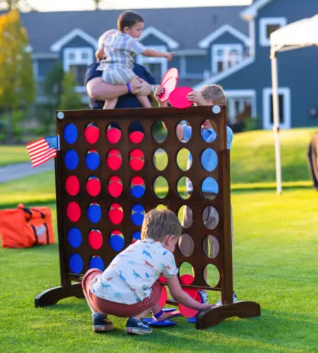 Children playing lawn games at The Preserve Resort's 4th of July Celebration