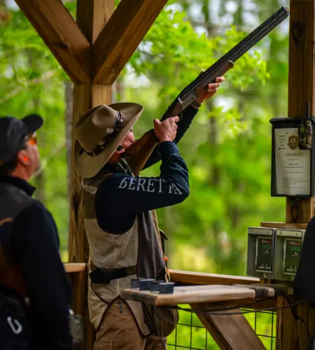 Participant at The Preserve Open 2024 aiming at a target